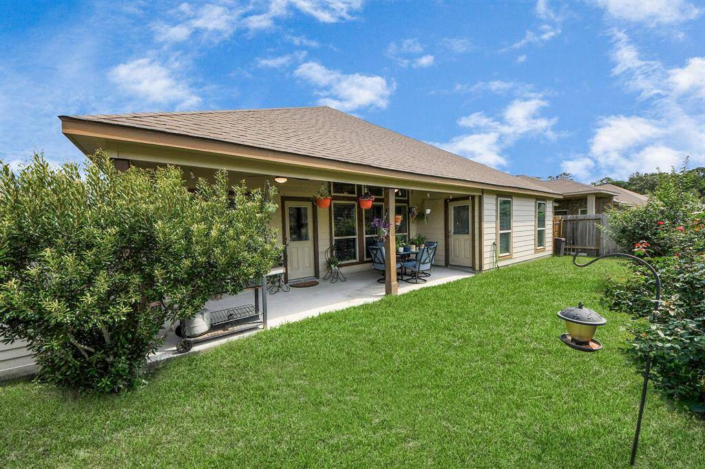 Private backyard with mature trees and fencing.