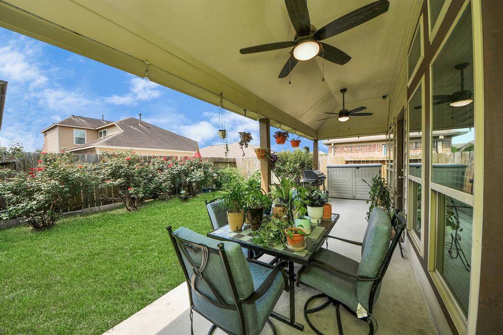 Ceiling fans and mature plants to enjoy your days on your private covered patio.