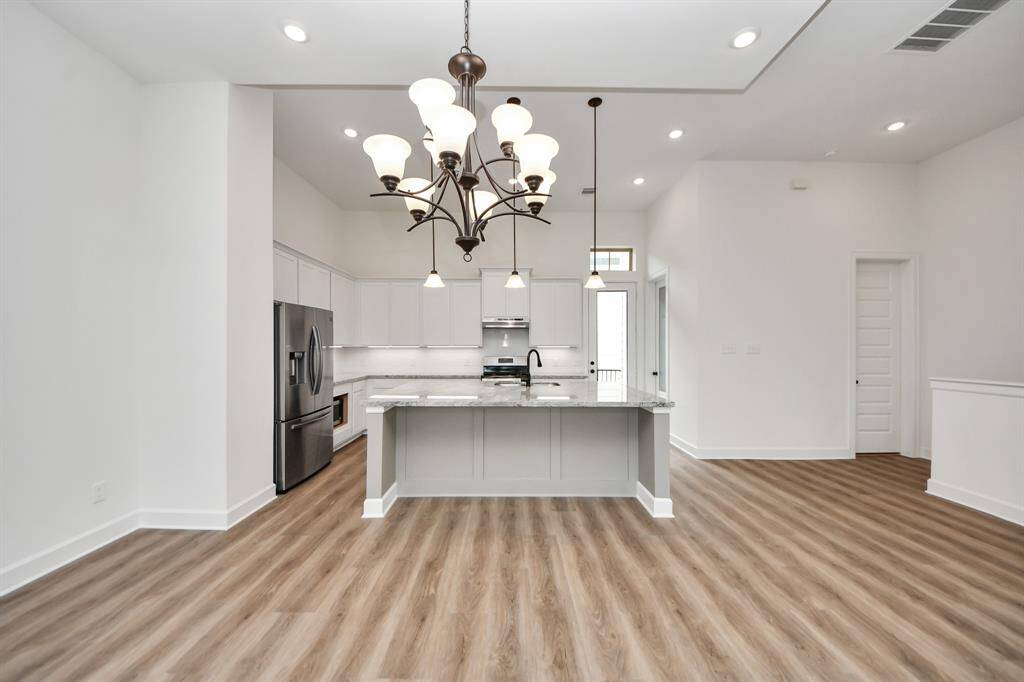 The kitchen also offers custom cabinetry with under cabinet lighting that elevates the space.