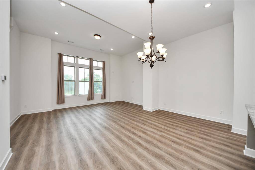 Large windows allow for abundant natural light, complementing the professionally curated interior palette.