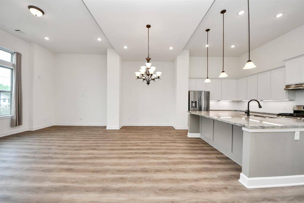 Spacious living/dining room combo with gorgeous ceilings