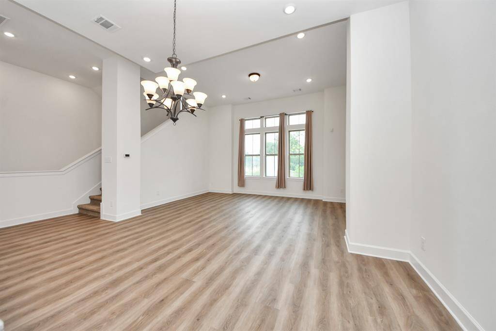 Spacious living/dining room with luxury chandelier