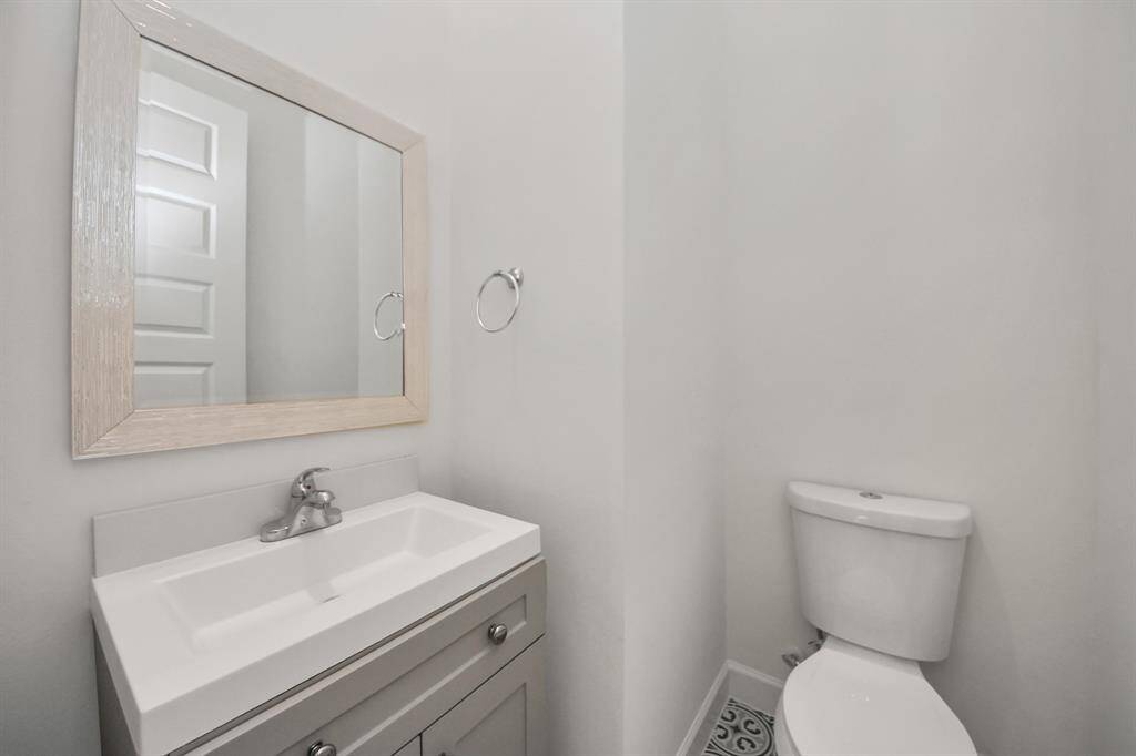 A stylish powder room is located on the 2nd floor, easily accessible from the main living and kitchen areas.