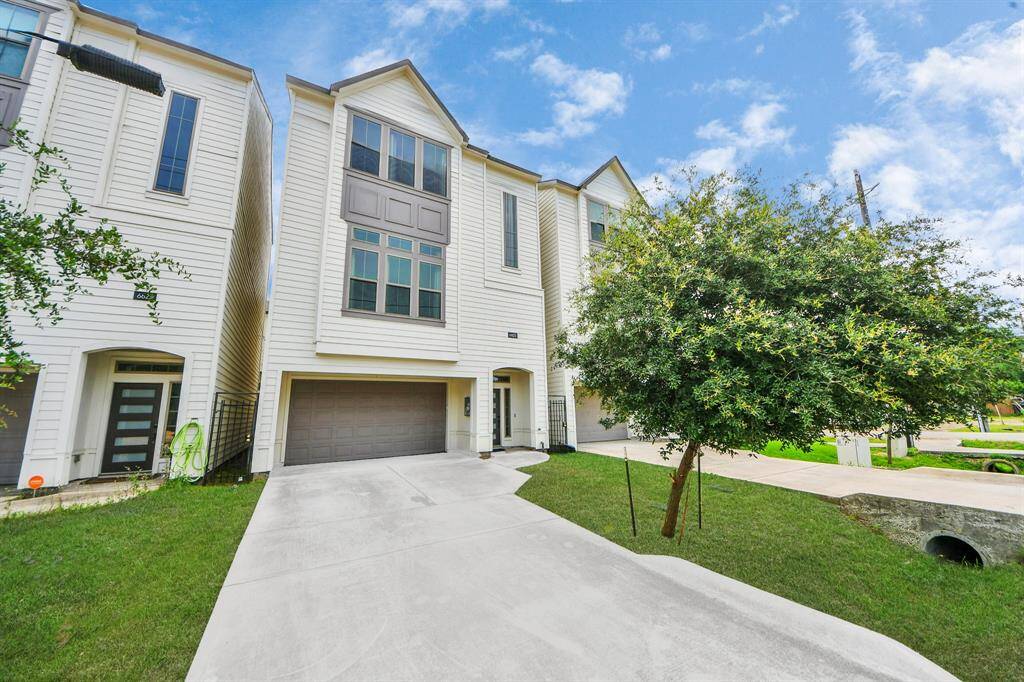 The home's exterior showcases a sleek, contemporary design with clean lines and a neutral color palette.