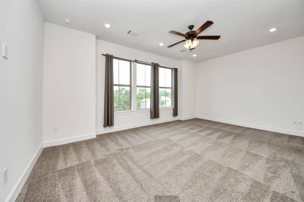 The primary bedroom is situated on the third floor