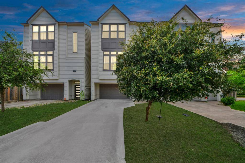 A two-car attached garage and a private driveway provide ample parking