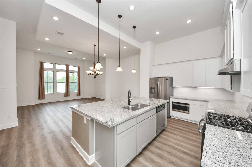 The main living areas boast 12-foot ceilings, creating an open and airy atmosphere.