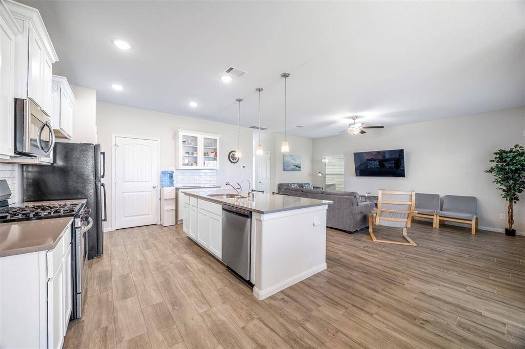 Another view of the spacious kitchen and living area.