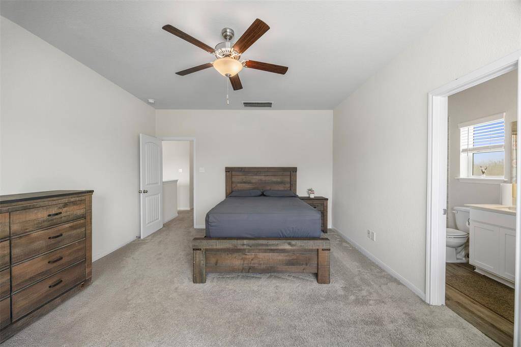 Another view of the primary bedroom.