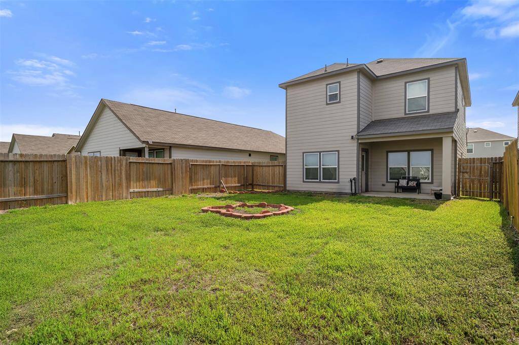 Spacious backyard with a well-maintained lawn, fenced for privacy. Features a covered patio, ideal for outdoor relaxation, and most definitely room for a pool.  A deck overlooking the lake sounds serene.