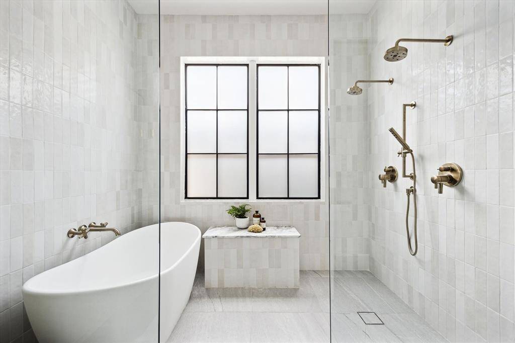 Primary bath with dual showers and solid surface soaking tub