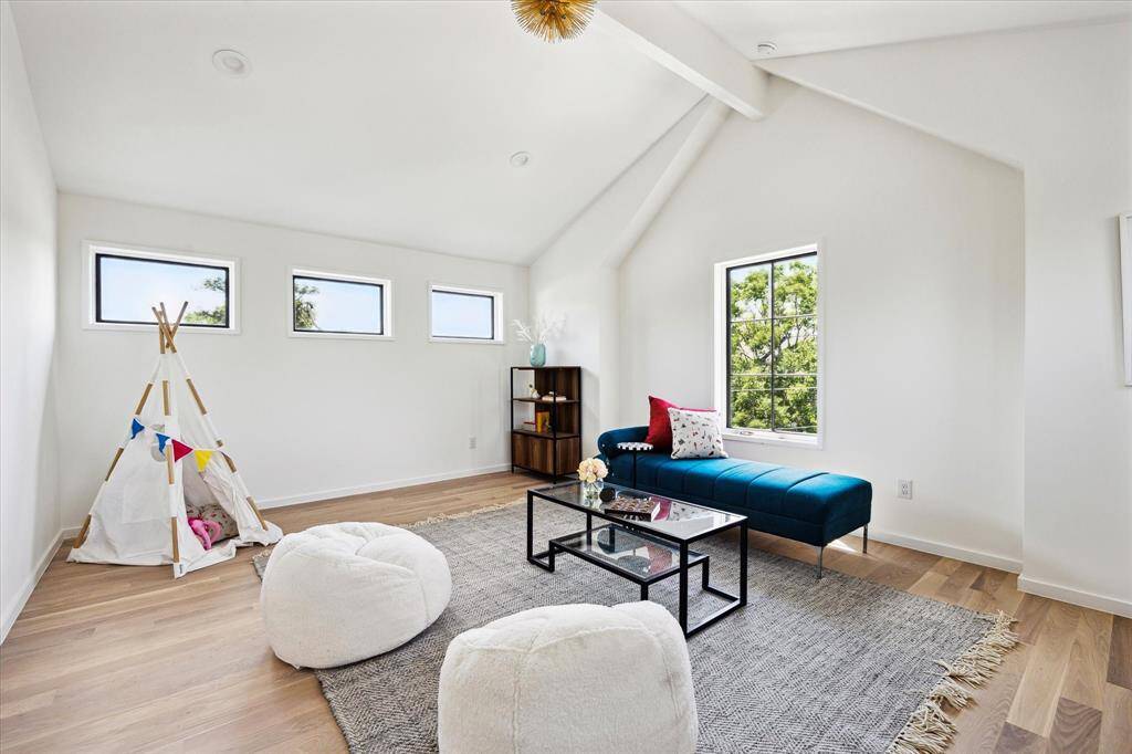 Game room on 3rd floor has downtown views! Could be a great exercise room, features a large storage closet and walk-in attic access