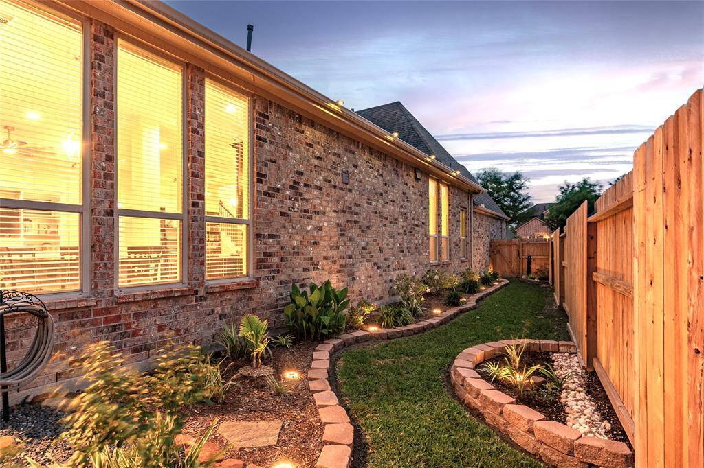 Envious Curb Appeal! The beautiful professionally landscaped yard features full gutters piped directly in-ground with hard PVC drains and drain grates. 4 exterior security cameras with base station, monitor, wireless router/antenna and remotes convey.