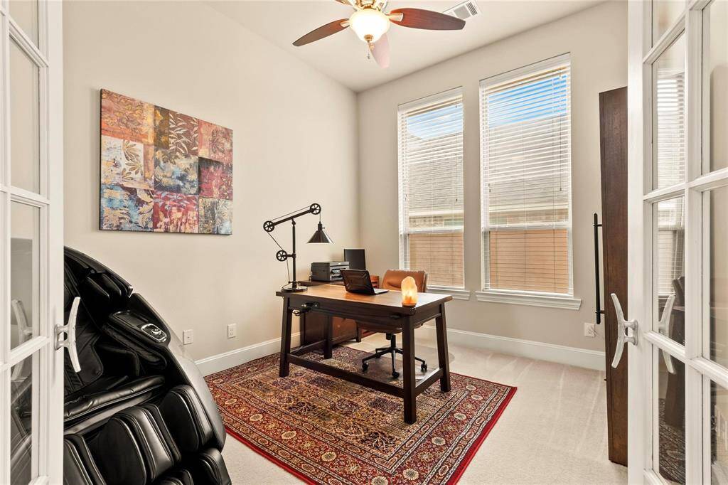 Modern home-office with French doors, neutral paint tones, large windows and ceiling fan. Cat-5 data drops in all rooms, hub in mud room with a pass-through to garage.