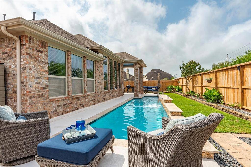 Just in time for Summer! 6’ deep swimming pool with tanning ledge, water features, Pentair components, Spray Deck, recent Maytronics Dolphin and Sta-Rite U-3 Skimmer for the pool.