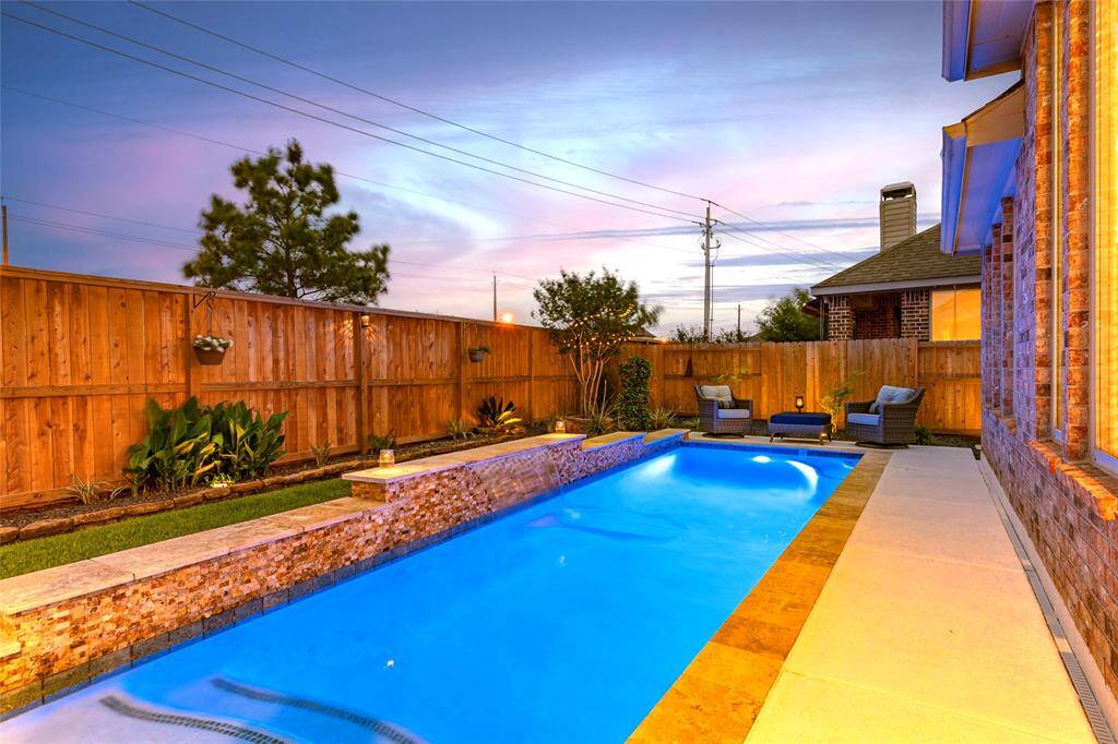 Welcome to 736 Mayhill Ridge Lane in Westover Park. Modern backyard with in-ground pool with tanning ledge and water feature, surrounded by Spray Deck patio and split-stone accented water ledge. Backyard showcases easily-maintained and professionally-installed landscape and hardscape including solar-powered lights, extensive pavers, rocks and stone decking throughout. Well-maintained privacy fence and tasteful landscaping are perfect for relaxing or entertaining.