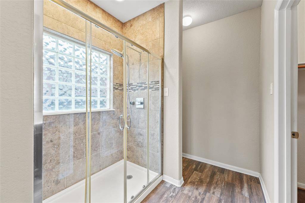 The primary bath has a spacious shower!
