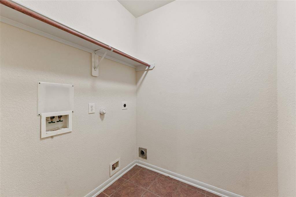 The utility room with washer and dryer connections-- gas and electric.