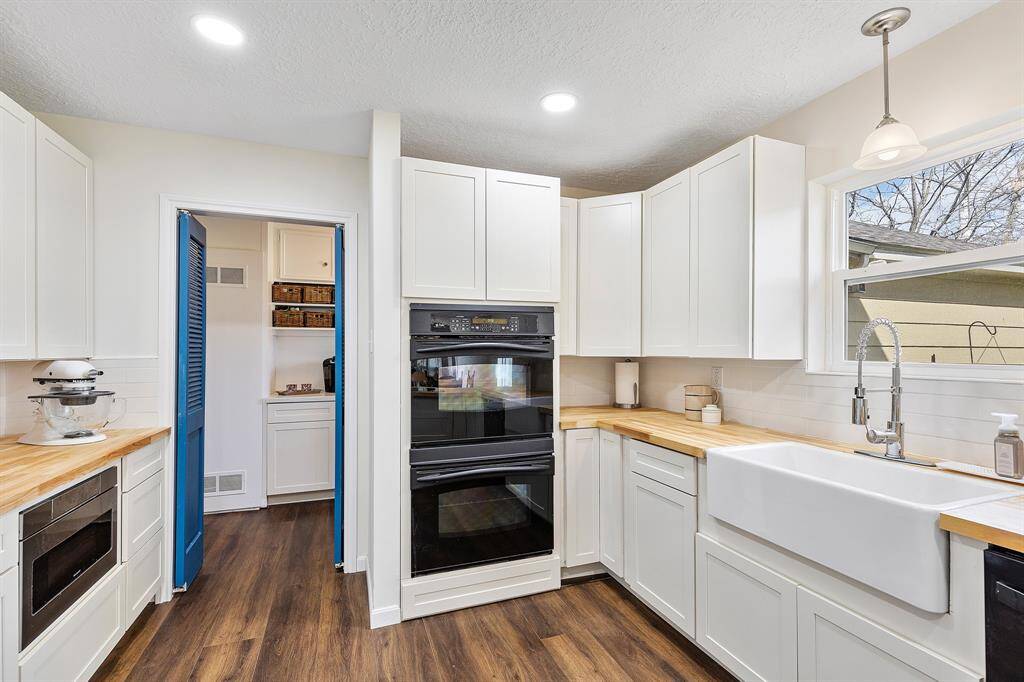 Entry leading to the half bath, laundry room and back door to  garage and backyard.