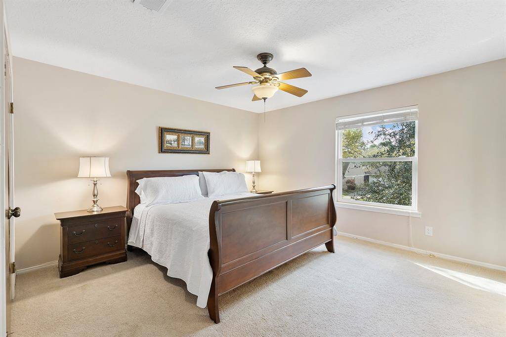 Discover the spacious primary bedroom, freshly painted and offering generous square footage for ultimate comfort.