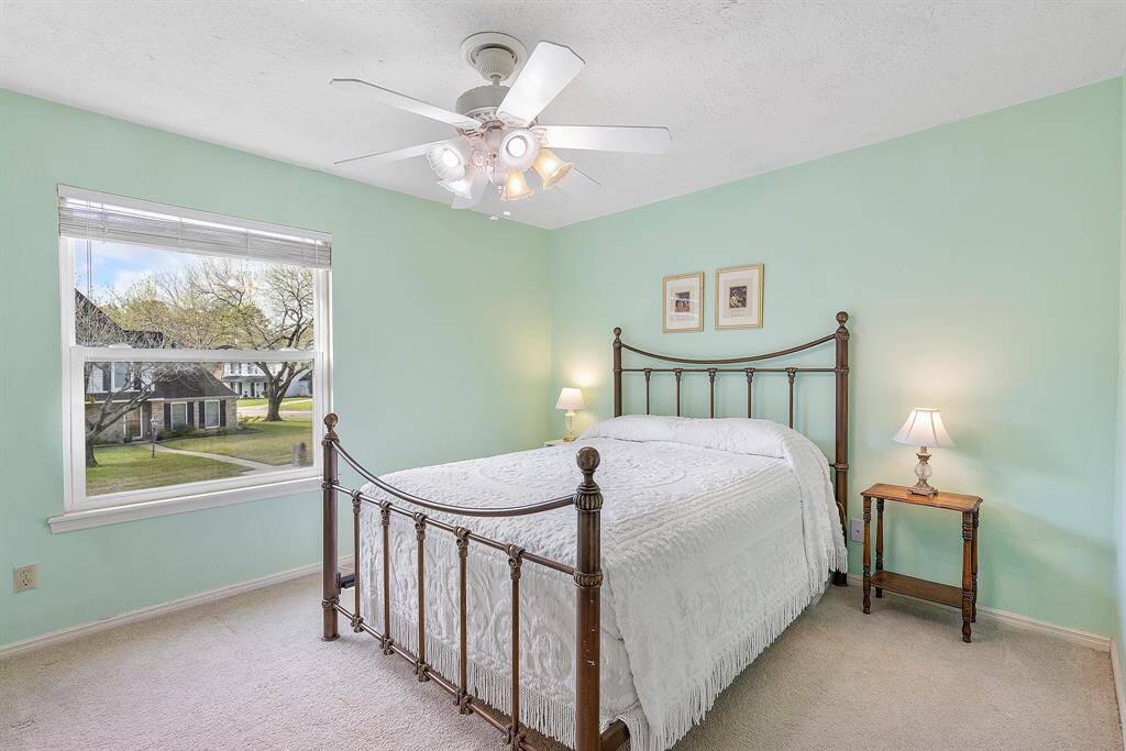 Expansive second bedroom with abundant natural light.