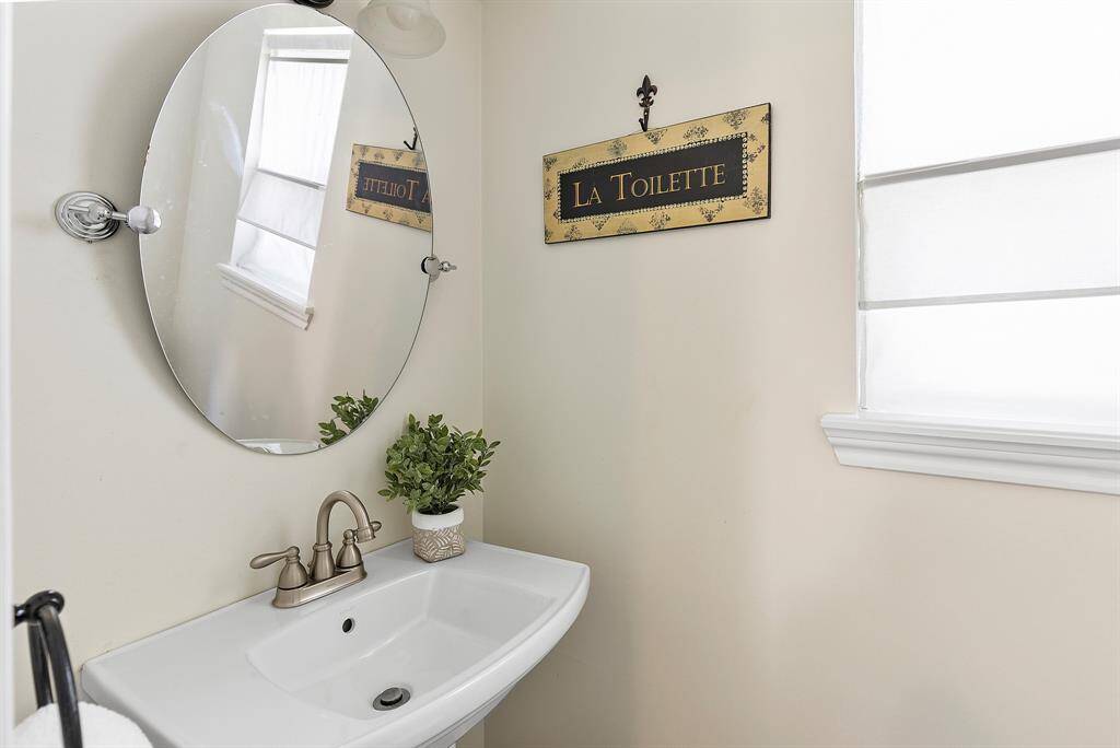 Stylishly remodeled half bath, perfect for guests.