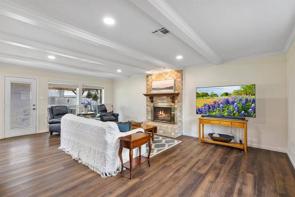 Cozy living area with a charming fireplace and modern lighting.