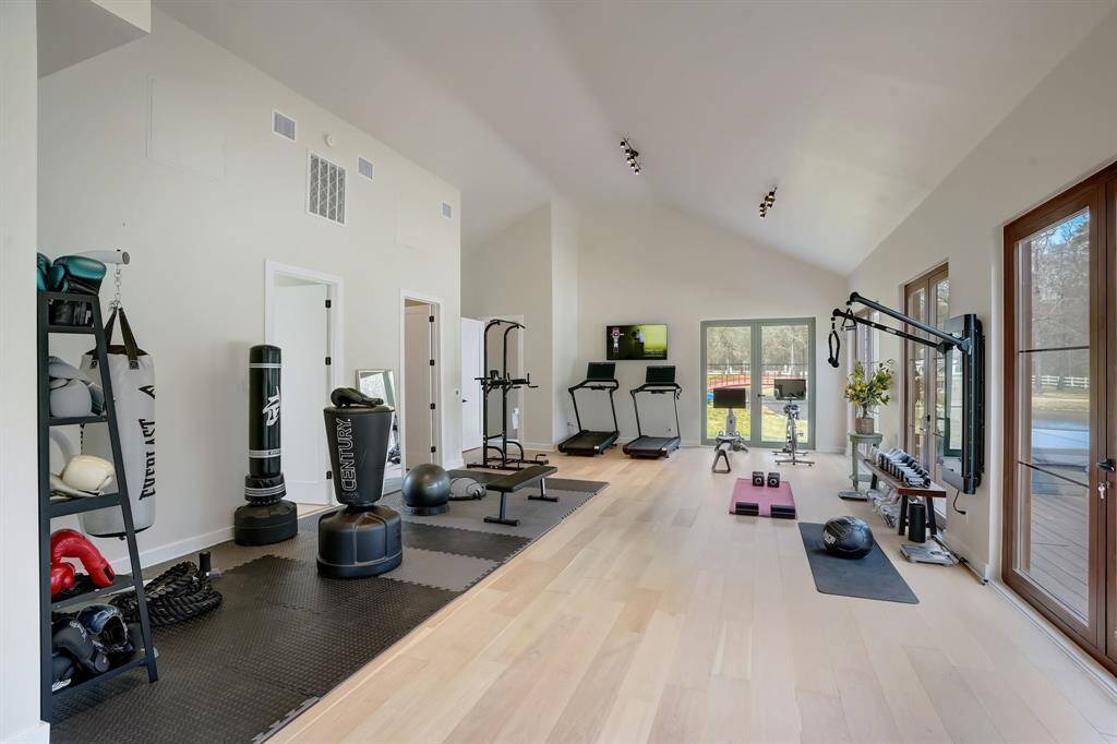Fully equipped home gym designed for a complete workout experience, with plenty of space and top-of-the-line gear.