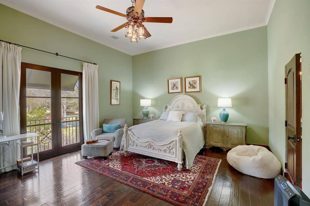 A spacious bedroom retreat with warm finishes and a calm, inviting atmosphere.