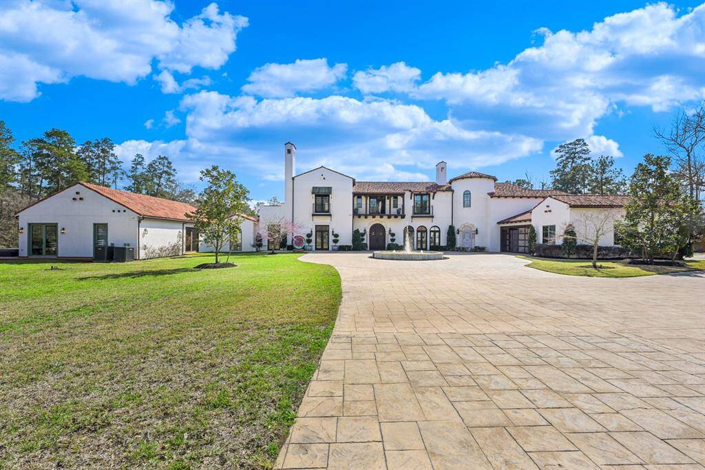 Classic colonial charm meets modern luxury in this grand front view of the home.