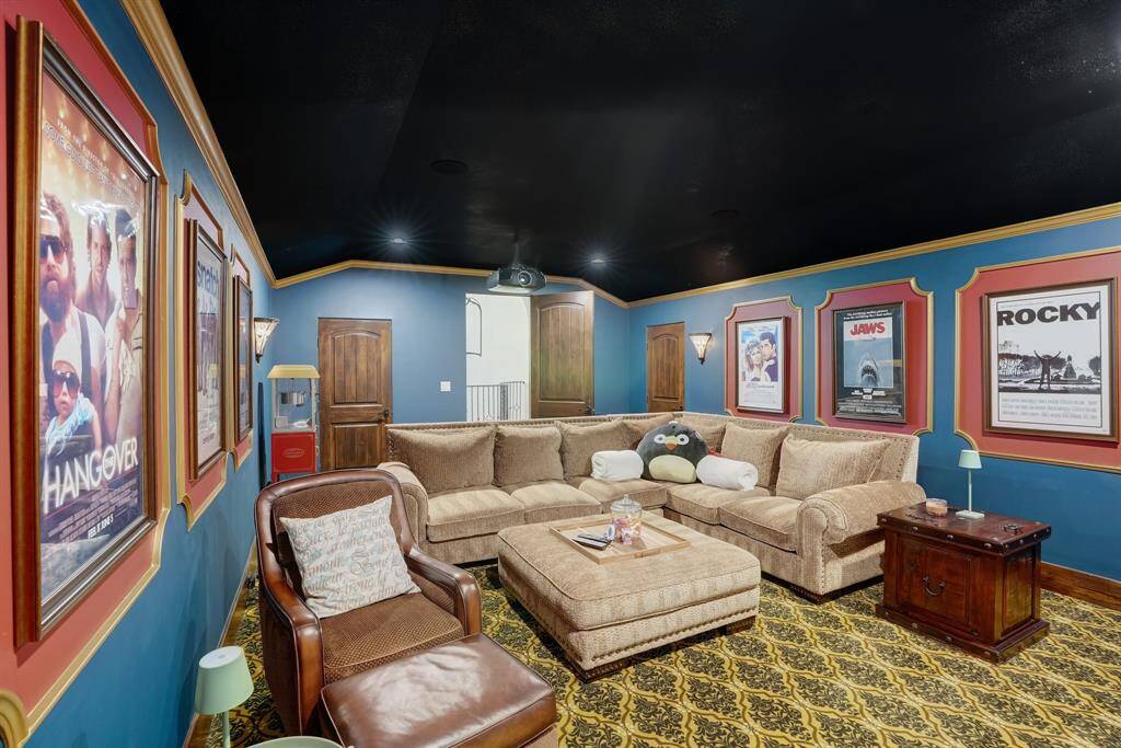 Front view of the movie theatre room, complete with iconic movie posters.