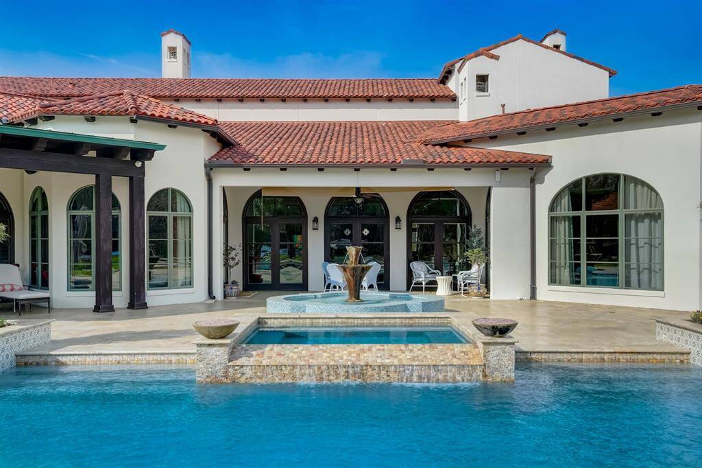 Enjoy peaceful moments by the pool, with a soothing fountain as your backdrop.
