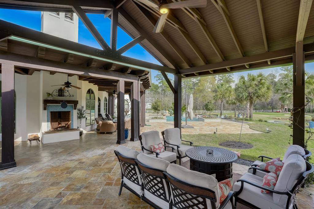 Relax and unwind in the cozy covered patio area, perfect for lounging and enjoying the outdoors year-round.
