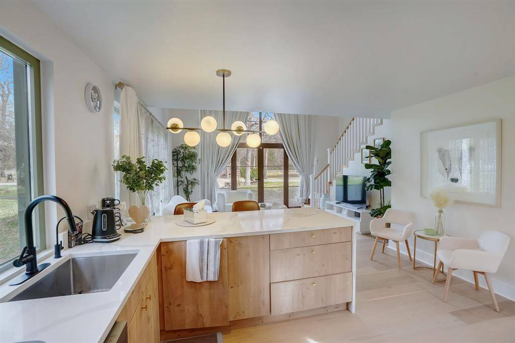 Step into a loft-inspired casita, where the entryway flows into a modern, open kitchen.