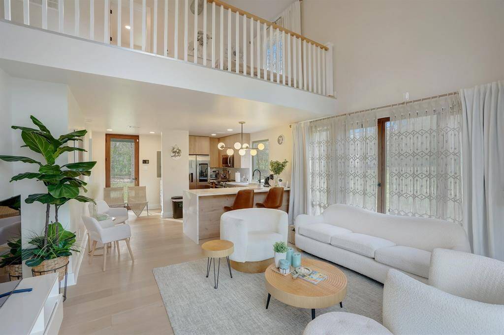 This loft offers the ideal blend of style and function, with a spacious living room flowing into a contemporary kitchen.