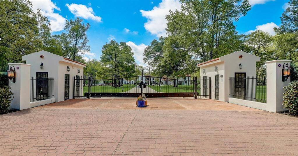 Grand front gate, providing an elegant entrance to this luxurious estate.