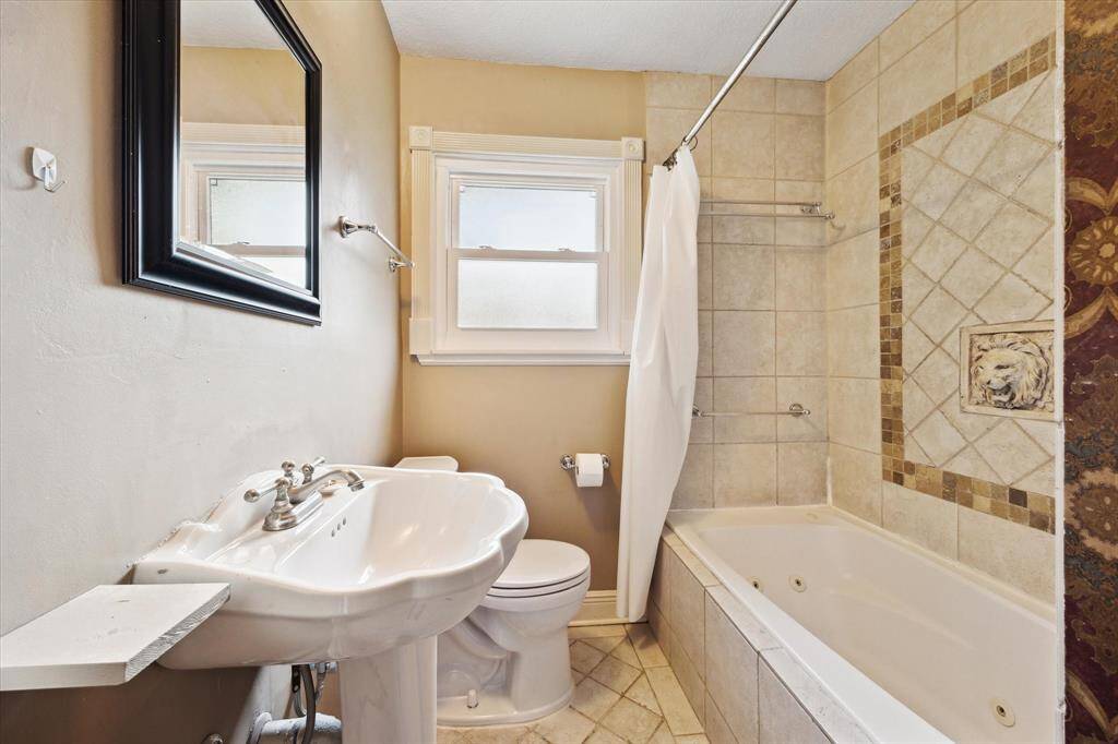 Bath with shower / tub combo.  Note the jetted tub!