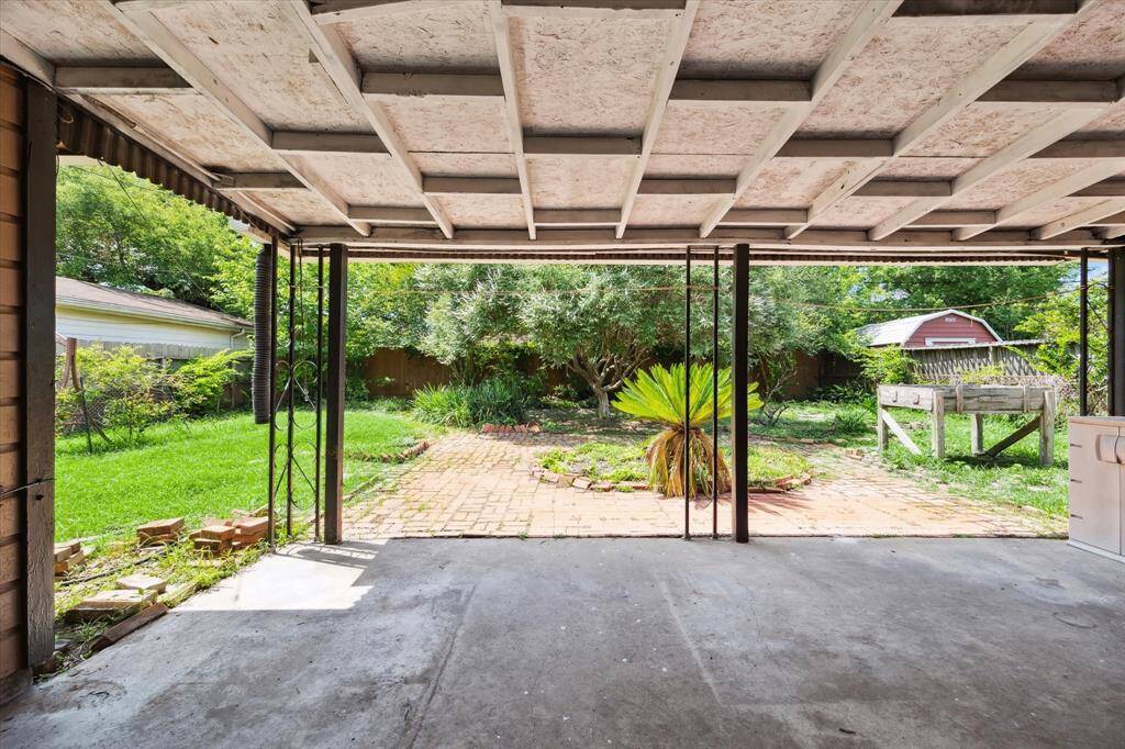 Covered back patio to enjoy the outdoors and large backyard that's a gardener's paradise!