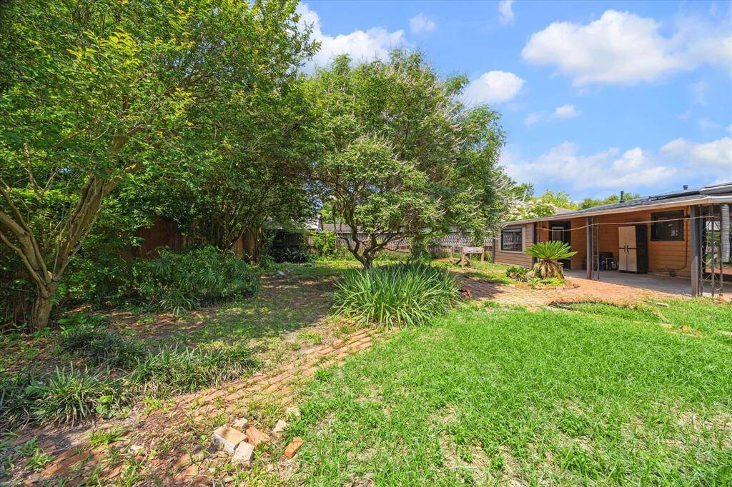 Another view of the backyard and patio