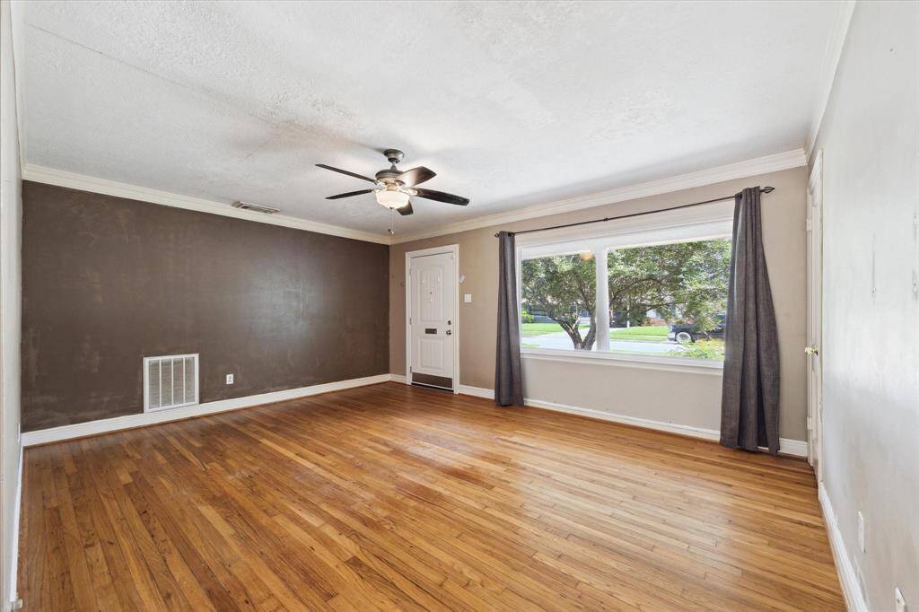 Another view of the living room. The front window lets in a lot of light.