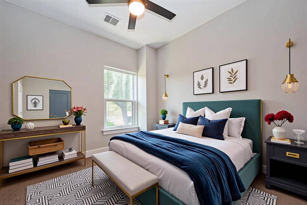 Bright & Comfortable Third BedroomSoaked in natural light, this third bedroom offers peaceful views, neutral tones, and cozy carpeting underfoot. A sleek ceiling fan ensures comfort year-round, making it a perfect fit for a secondary bedroom, creative studio, or a peaceful work-from-home space.