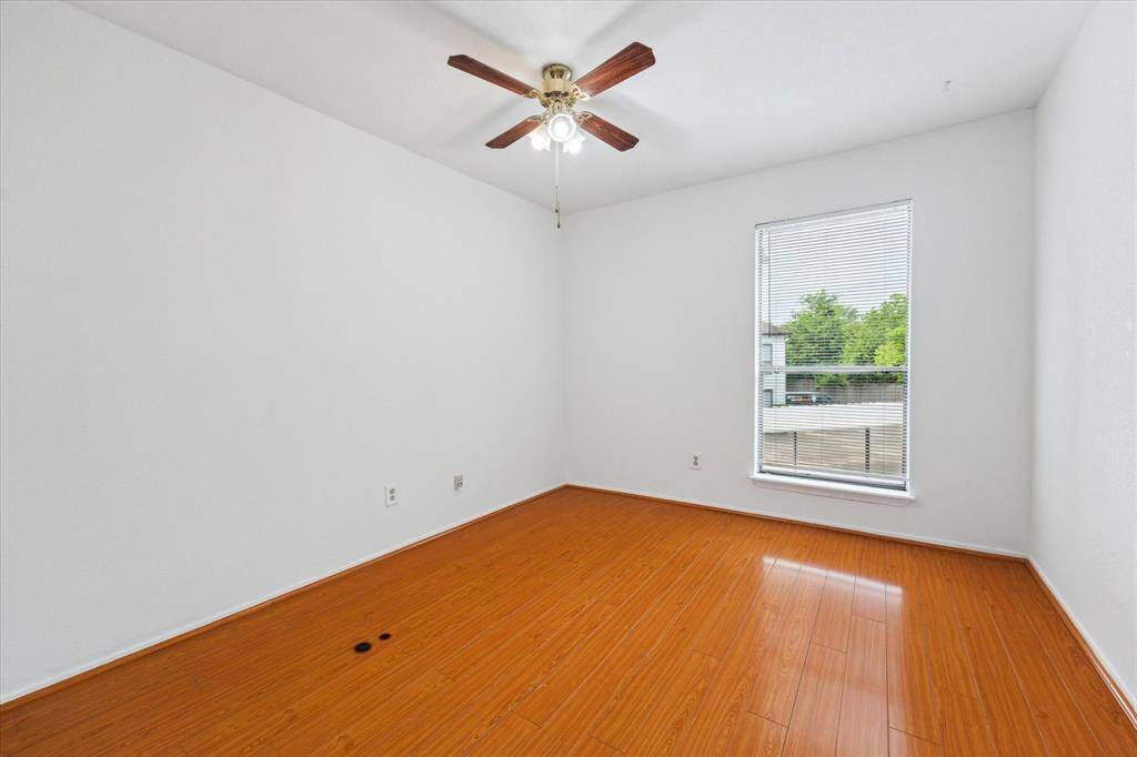 Spacious and well lit guest bedroom and closet.