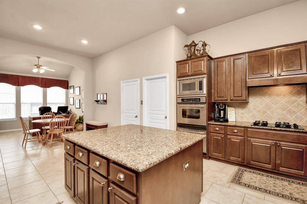 Entertaining is a breeze with this spacious kitchen, complemented by additional space off the kitchen and breakfast area.