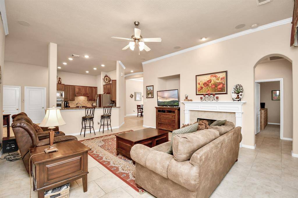 Here is a comprehensive view of the entire area, from the dining room to the kitchen, flowing into the den.