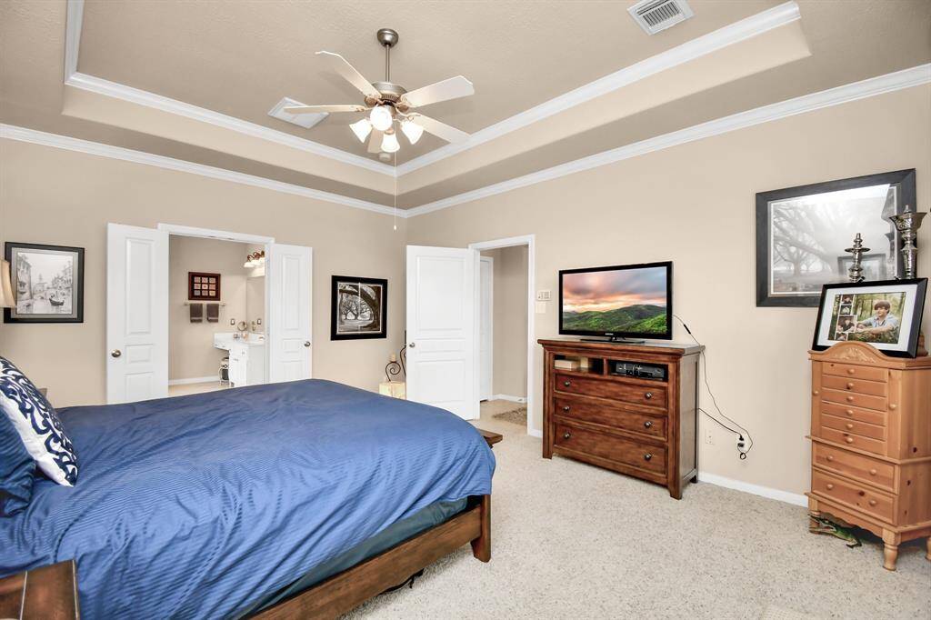 With ample space for a sitting area and a king-size bed, this primary sanctuary offers the perfect balance of comfort and luxury.