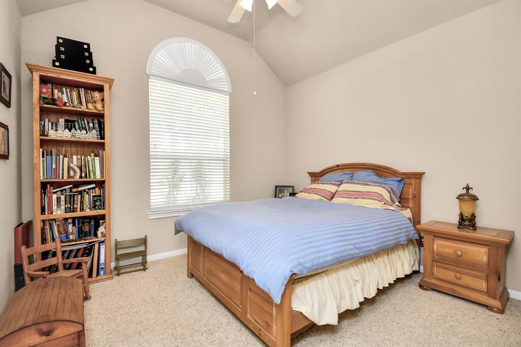 Toward the front of the home, there is an additional secondary bedroom, which serves as the perfect guest suite when hosting visitors.