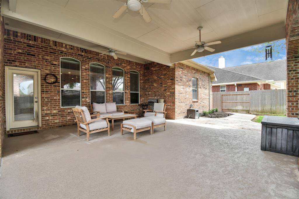 This expansive covered patio is a delight for those who relish outdoor living or enjoy barbecuing, offering space for relaxation and al fresco dining.