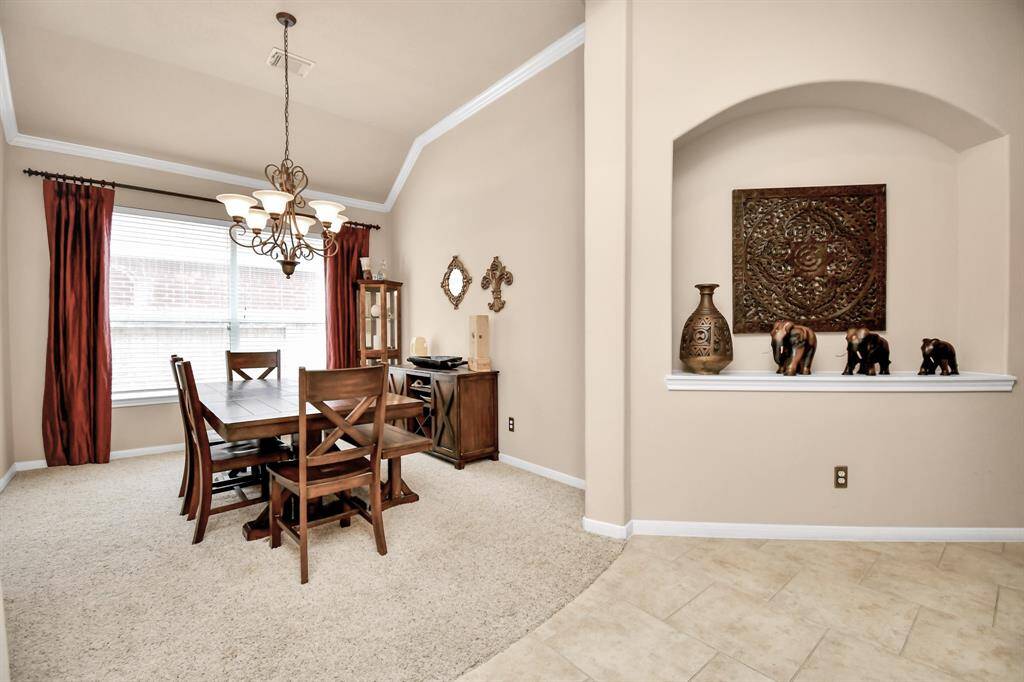 Beyond the dining room, another art niche awaits, guiding you into the heart of the home.