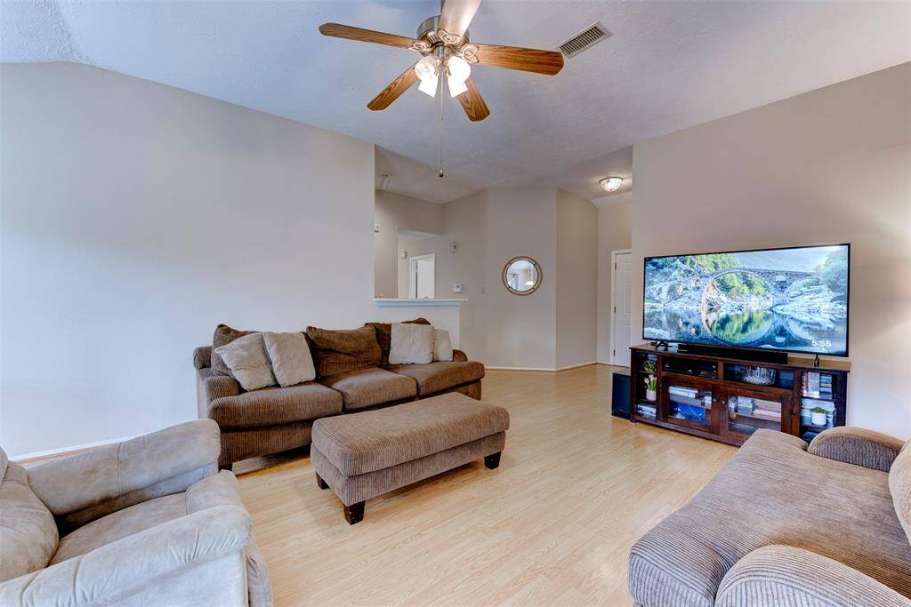 Final look at the main living areas before entering the bedroom hallway—an open, flowing layout with great natural light and connectivity throughout the home.