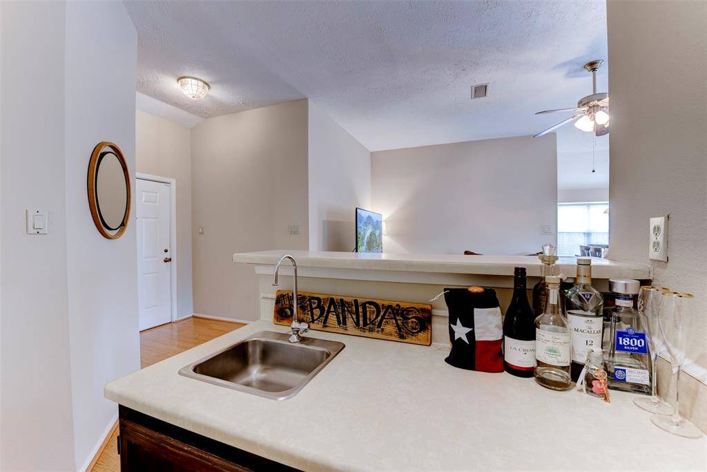 Enjoy your own spacious wet bar—perfectly positioned off the living area for easy entertaining and everyday convenience.